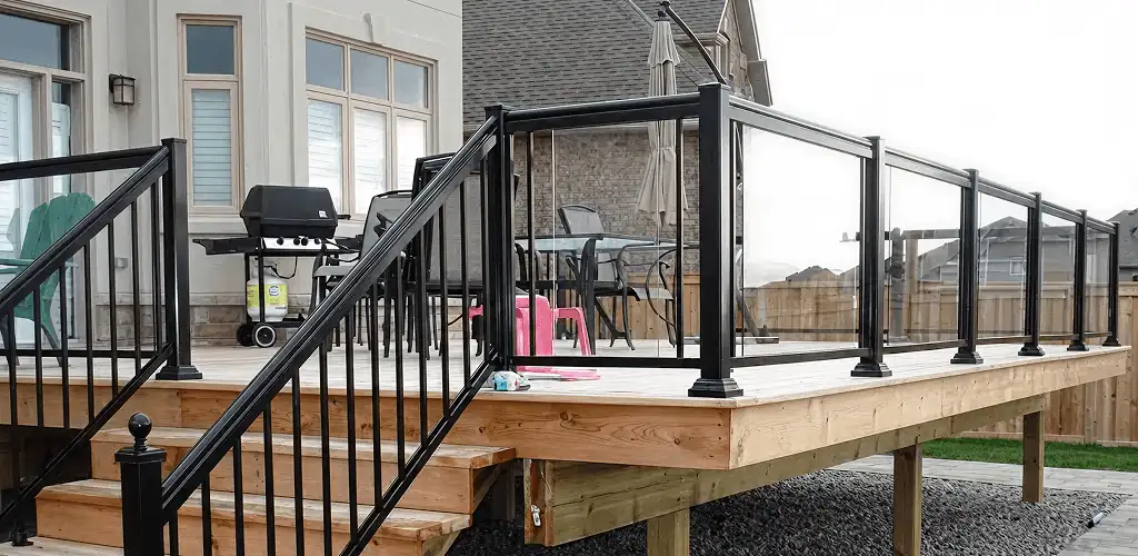 Handrail installation on a deck staircase for safety and code compliance in Baton Rouge, LA
