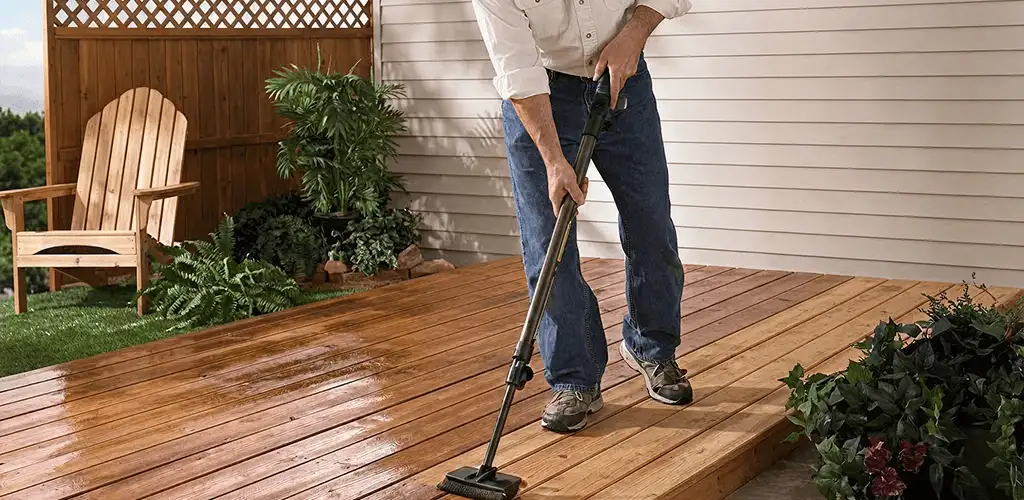 Deck staining service applying stain to a backyard wood deck in Baton Rouge, LA